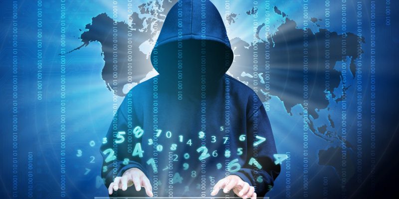 Computer,Hacker,Silhouette,Of,Hooded,Man,With,Binary,Data,And